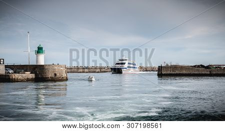 Ferry That Enters The Harbor Of The Island Of Yeu, France