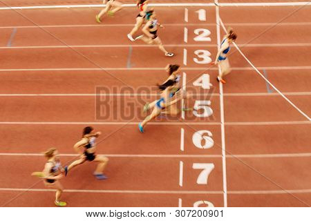 Finish Line Woman Runners Sprinters Run 100 Meters Motion Blur
