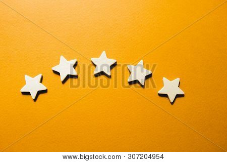 Five White Stars On An Orange Background