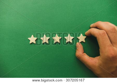 Five White Stars On A Green Background