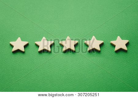 Five White Stars On A Green Background