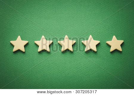 Five White Stars On A Green Background