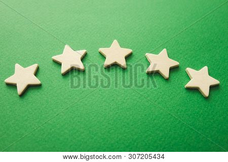 Five White Stars On A Green Background