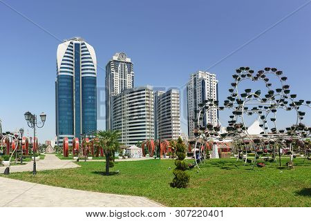 Picturesque View Of The Complex Of High-rise Buildings Of Grozny City From The Flower Park In The Ci