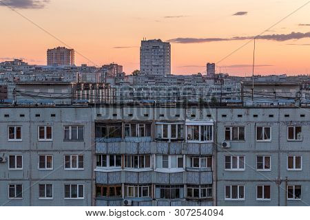 Windows, Roofs And Facade Of An Apartment Building In Russia