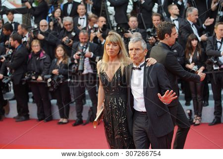 CANNES, FRANCE - MAY 17, 2019: TV and radio host Nagui  and his wife  Melanie Page  attend the screening of 
