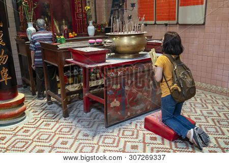 Kuala Lumpur, Malaysia. January 2019.   Believer Pray In Front Of The Altar In Sin Sze Si Ya Temple