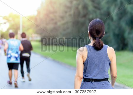 Woman Exercise Walking In The Park In The Morning.