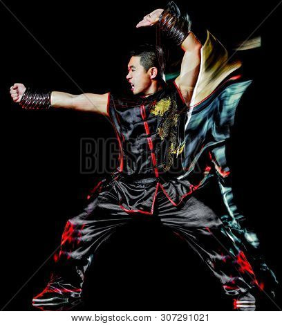 whushu chinese boxing kung fu Hung Gar fighter isolated man isolated on black background with speed light painting effect motion blur