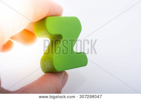 Hand Holding Letter Cube Z Of Made Of Wood