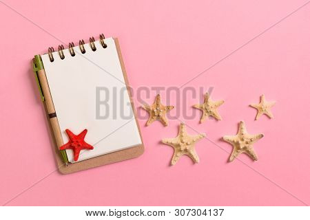 Blank Note Book With Starfish Or Seashells On A Pink Background , Summer Vaction Concept