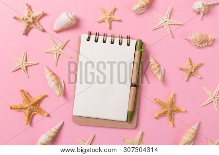 Blank Note Book With Starfish Or Seashells On A Pink Background , Summer Vaction Concept