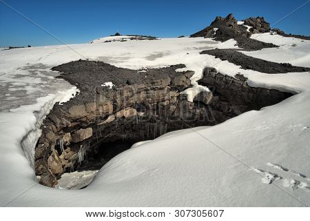 entrance Cave Ice (Grotta del Gelo) in winter Etna National Park, Sicily