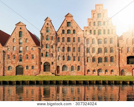 Historic Salzspeicher Warehouses In Lubeck, Germany Against Clear Blue Sky
