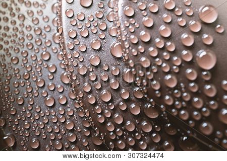Drops Of Water On The Plastic Cover Of Drink Of Coffee, Macro