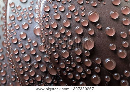 Close-up Drops Of Water On Brown Plastic Cover Of Drink Of Coffee