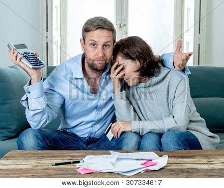 Young Couple Feeling Sad And Stressed Paying Bills Debts Mortgage Having Financial Problems