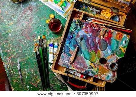 Colorful Workplace Of The Artist With Il Paints - Vertical