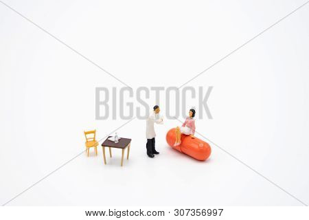 Miniature People Consult A Doctor To Ask For Health Problems. Annual Health Check Or Consult A Docto