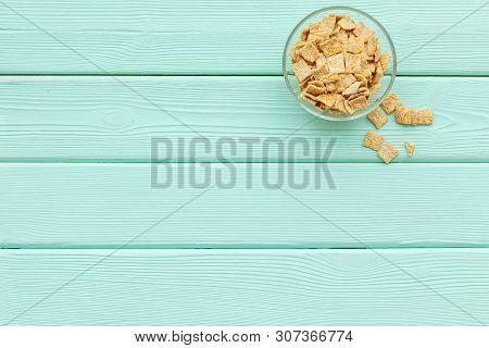 Cereals, Oatflakes And Cornflakes For Healthy Breakfast On Mint Wooden Background Top View Mock Up