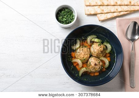 Flat Lay Composition With Jewish Matzoh Balls Soup On White Wooden Table. Space For Text