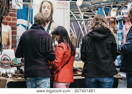 London, Uk - June 15, 2019: People Browsing Items At Stalls Inside Spitalfields Market, One Of The F
