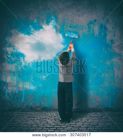 Improve Your Perspective. Child Paints A Sky On A Gray Wall
