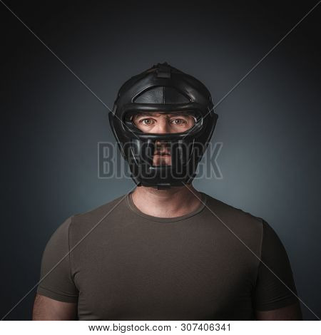portrait of krav maga practitioner wearing a protective training mask.