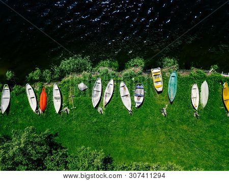 Aerial View Of Colorful  Boats In A Row On The Shore Of Lake In Finland