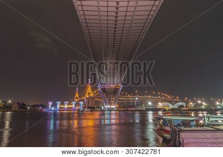 Bhumibol Bridge, Chao Phraya River Bridge. Turn On The Lights In Many Colors At Night.