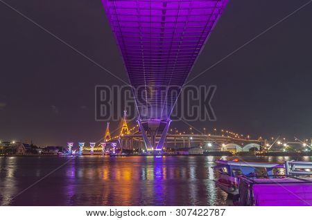 Bhumibol Bridge, Chao Phraya River Bridge. Turn On The Lights In Many Colors At Night.
