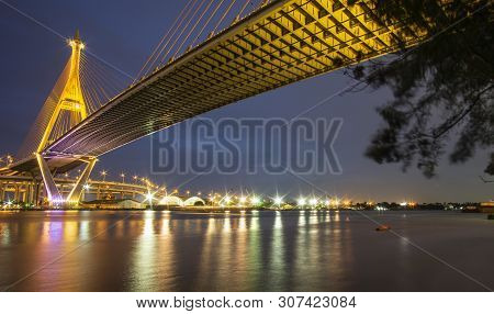 Bhumibol Bridge, Chao Phraya River Bridge. Turn On The Lights In Many Colors At Night.