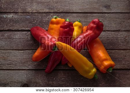 Ripe Colorful Ramiro Peppers On Rustic Wooden Background