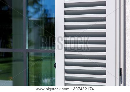 Wooden Shutters Of Gray Color, Close Up Of The Exterior Of The House In The Italian Style.