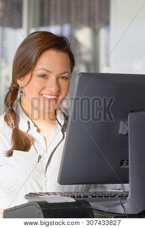 A Barmaid Registrating New Order By Cash-register. A Restaurant Worker Registrating New Order By Cas