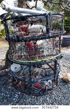 This Vertical Image Has Fishing Stuff And Equipment In A Yard While Waiting To Be Put Onto A Boat.  