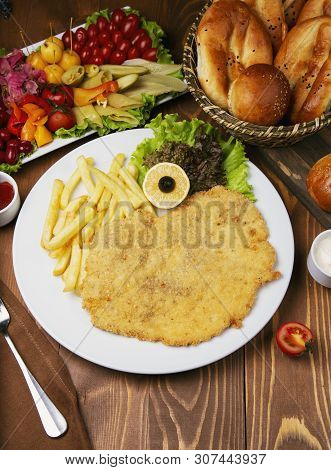 Roasted Chicken Nugget, Breast With French Fries. Served With Begetable Salad And Turshu Varieties. 