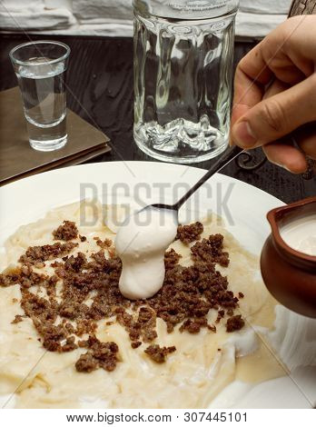 Adding Yogurt To Traditional Caucasian Meal Khingal, Khinkali With Meat. Image