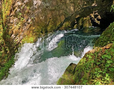 The Cave And The Source Hundsloch By The Alpine Lake Wagitalersee Or Waegitalersee, Innerthal - Cant