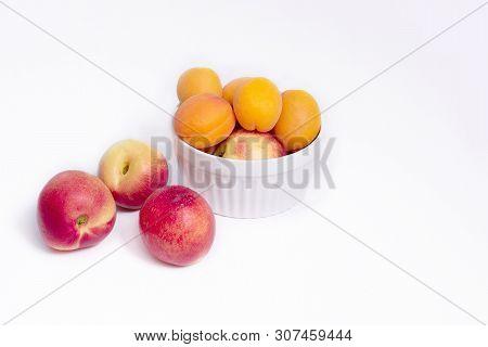 Group Of Whole Nectarine And Apricots Fruit Isolated On White Background