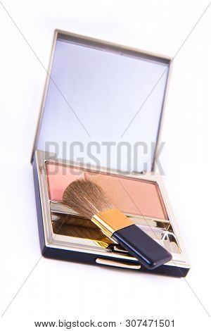 blush with mirror and a brush isolated on white
