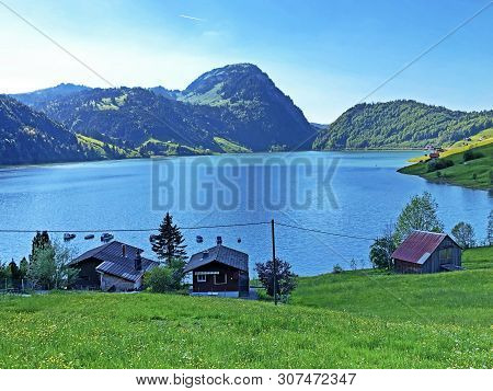Traditional Architecture And Farmhouse In The Valley Of Wagital Or Waegital And By The Alpine Lake W