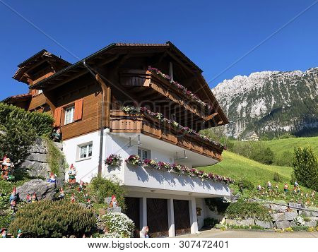 Traditional Architecture And Farmhouse In The Valley Of Wagital Or Waegital And By The Alpine Lake W