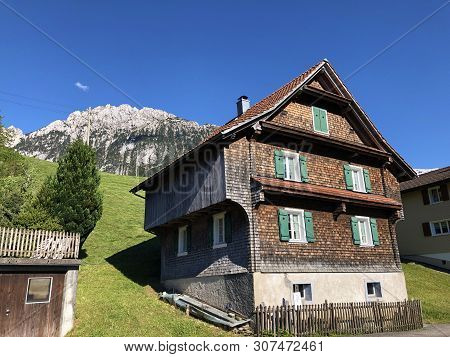 Traditional Architecture And Farmhouse In The Valley Of Wagital Or Waegital And By The Alpine Lake W