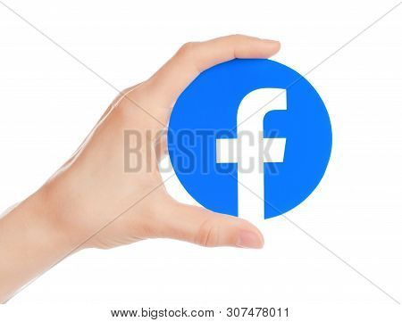 Kiev, Ukraine - May 15, 2019: Hand Holds New Facebook Logo Printed On Paper. Facebook Is A Well-know