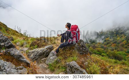 Khopra, Nepal - Oct 3, 2017: A Woman On Trekking Trail Of Annapurna Circuit Trek In Summer Day. Nume