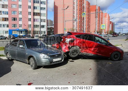 Novyy Urengoy, Russia - June 20, 2019: Crashed Cars Lada Priora And Ford Focus In The City Street.