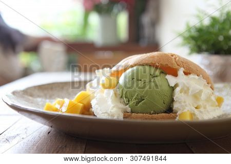 Cream Puff On A Plate In Closeup