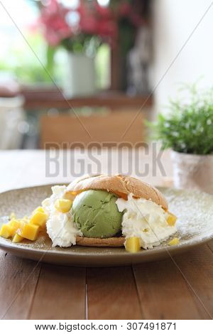 Cream Puff On A Plate In Closeup