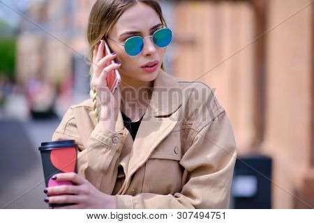 woman using smartphone in caffee shop. smart phone or mobile 